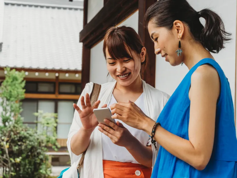 Two people staying connected while traveling