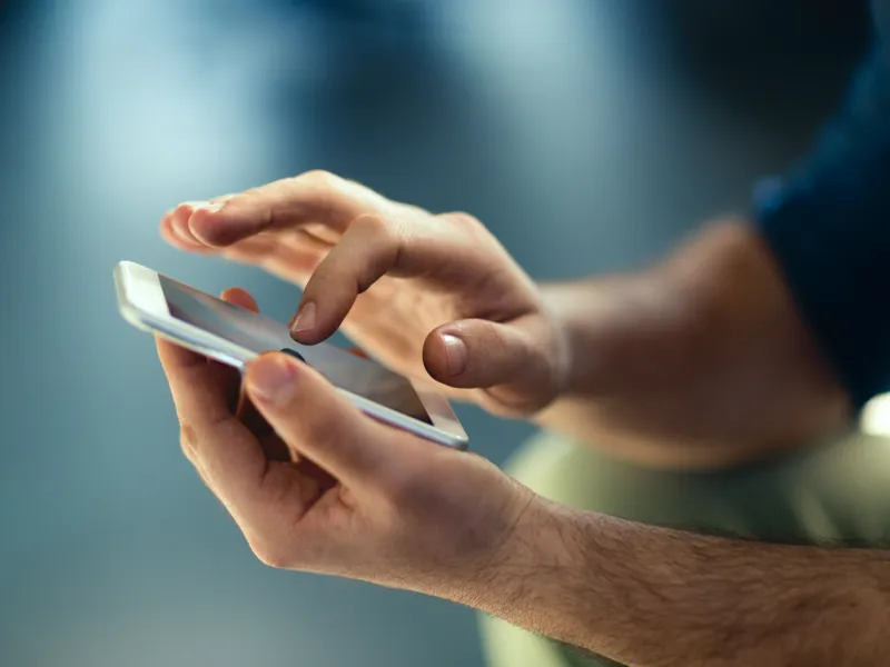 Person using smartphone with eSIM